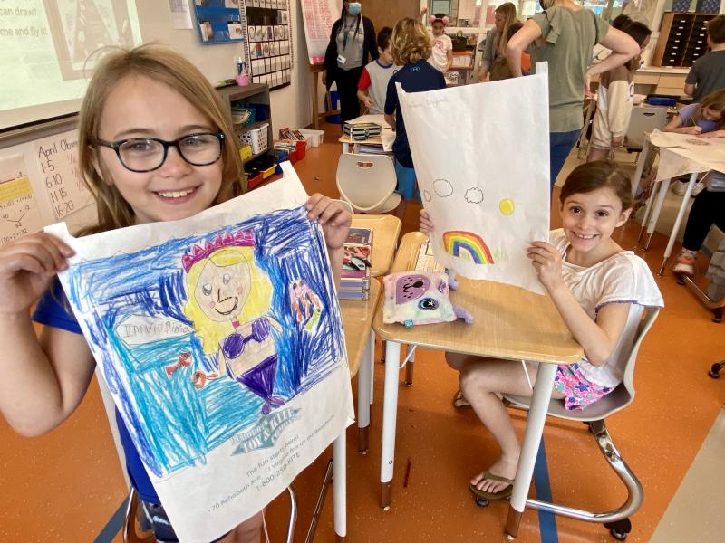 Virginia Lamb, left, and Giuliana Fitzgerald show off their colorful flags.